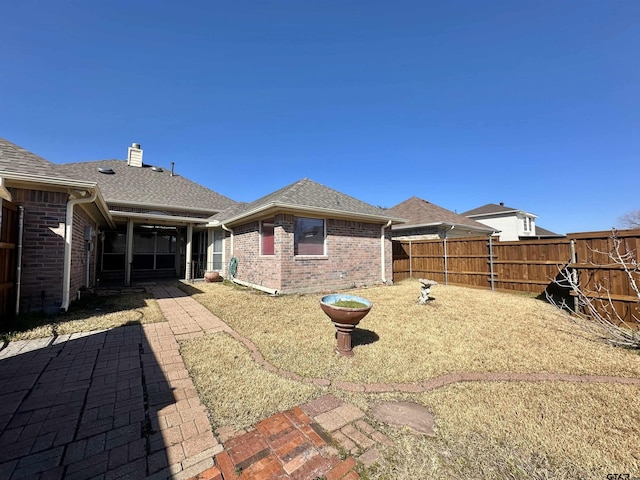 rear view of property featuring a patio