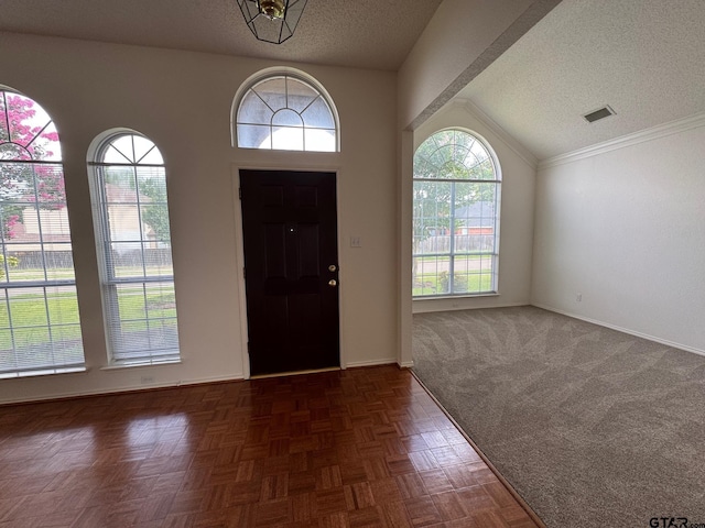 2414 Stillwater Dr, Mesquite, TX 75181 - foyer with lofted ceiling and a textured ceiling