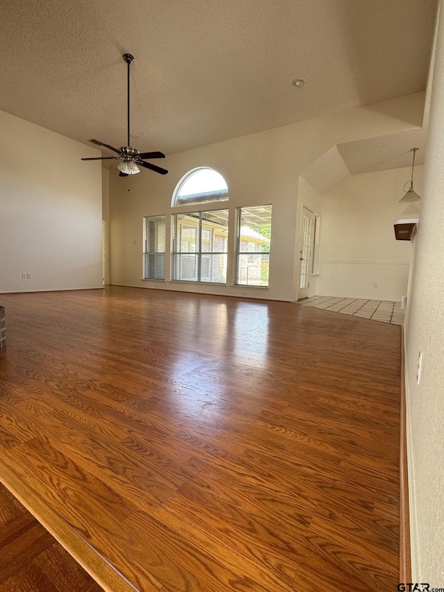 2414 Stillwater Dr, Mesquite, TX 75181 - empty room with wood finished floors, a textured ceiling, and a ceiling fan