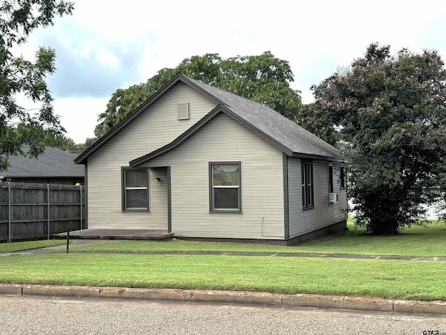 view of home's exterior featuring a yard