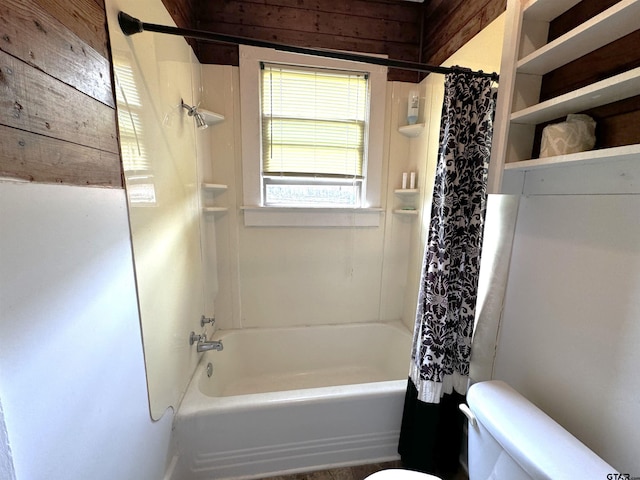 bathroom with toilet and shower / bath combination with curtain