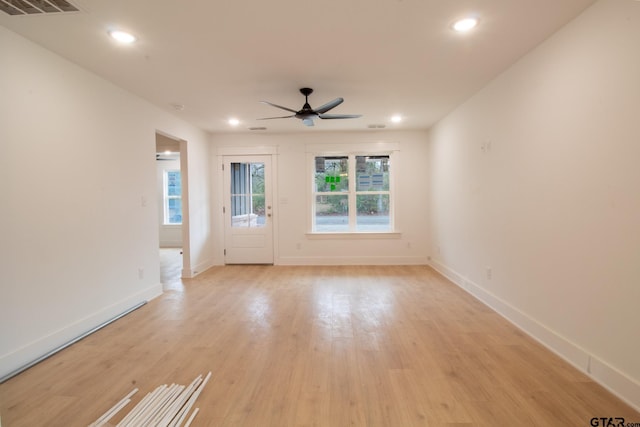 unfurnished room featuring ceiling fan and light hardwood / wood-style flooring