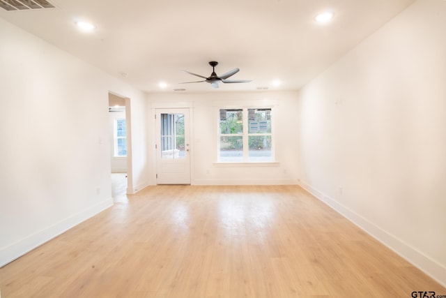 unfurnished room with ceiling fan and light hardwood / wood-style floors