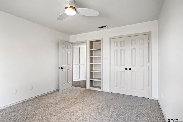 unfurnished bedroom with carpet and ceiling fan