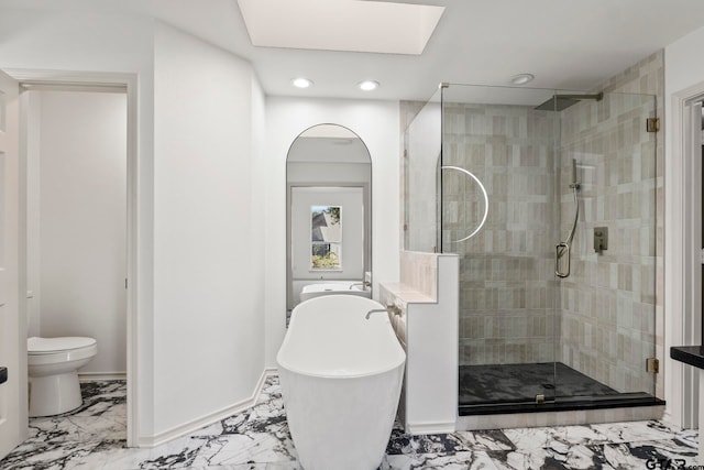 bathroom featuring toilet and shower with separate bathtub