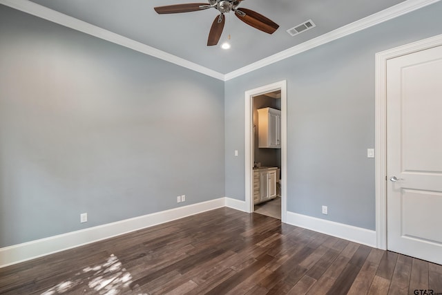 spare room featuring ceiling fan, dark hardwood / wood-style flooring, and ornamental molding