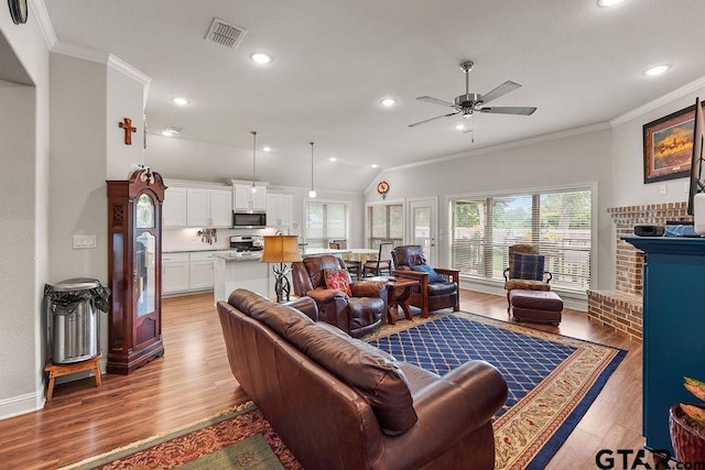 11317 Lindsey Gdns, Tyler, TX 75709 - living area featuring crown molding, light wood-type flooring, a ceiling fan, recessed lighting, and baseboards