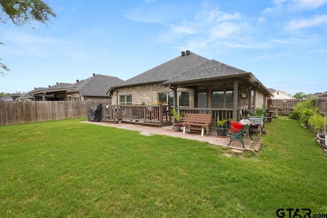 11317 Lindsey Gdns, Tyler, TX 75709 - rear view of property featuring roof with shingles, brick siding, and a patio