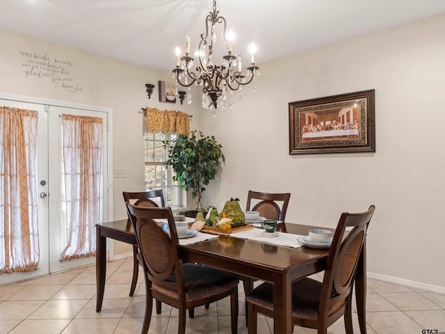 dining area featuring french doors and light tile patterned floors