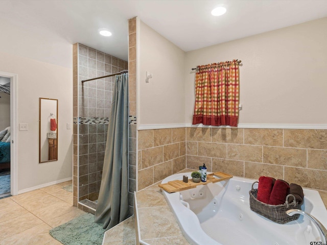 bathroom featuring tile patterned floors and shower with separate bathtub