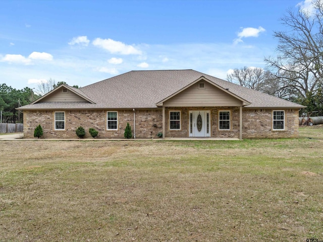 single story home with a front yard