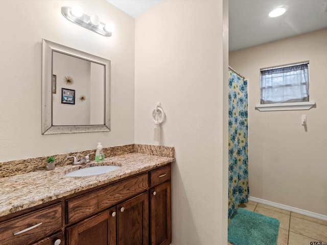 bathroom with tile patterned floors, a shower with shower curtain, and vanity