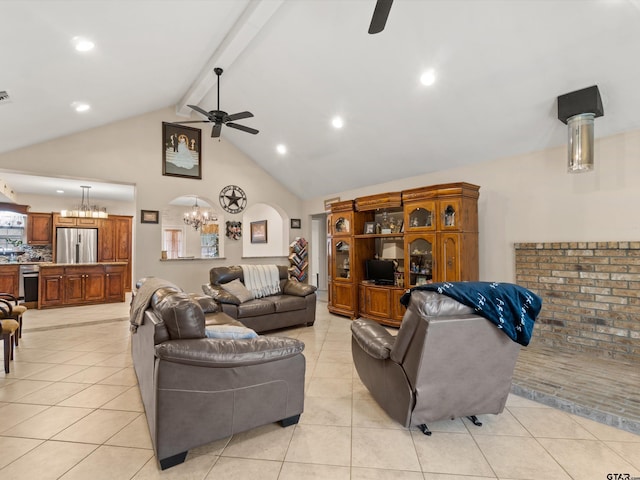 living room featuring ceiling fan with notable chandelier, high vaulted ceiling, beamed ceiling, and light tile patterned floors