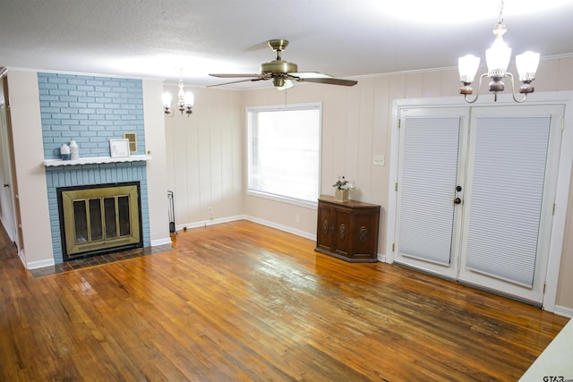 3008 Oak Knob Dr, Tyler, TX 75701 - unfurnished living room with a chandelier, hardwood / wood-style flooring, crown molding, ceiling fan, and a brick fireplace