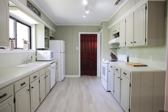 3008 Oak Knob Dr, Tyler, TX 75701 - kitchen featuring white appliances, under cabinet range hood, light wood-style flooring, crown molding, and light countertops