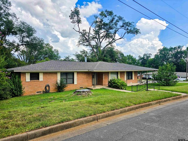 3008 Oak Knob Dr, Tyler, TX 75701 - ranch-style house featuring brick siding, a front lawn, and a shingled roof