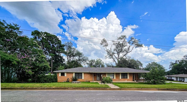 3008 Oak Knob Dr, Tyler, TX 75701 - ranch-style home with a front lawn and brick siding