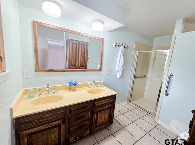 3008 Oak Knob Dr, Tyler, TX 75701 - bathroom with a shower stall, tile patterned flooring, and double vanity