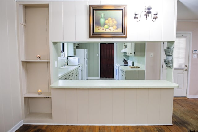 3008 Oak Knob Dr, Tyler, TX 75701 - kitchen featuring white appliances, dark wood-style flooring, light countertops, white cabinetry, and crown molding