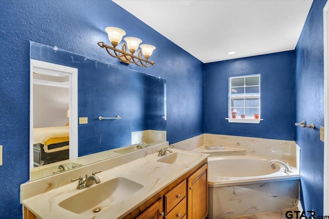 bathroom with vanity and a tub