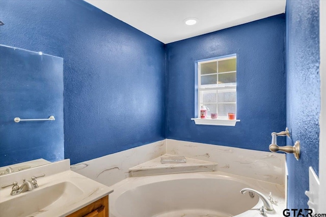 bathroom featuring vanity and a bathing tub