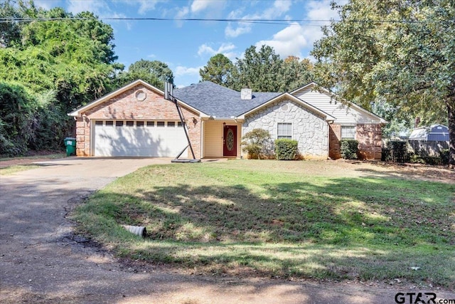 ranch-style house featuring a garage and a front lawn