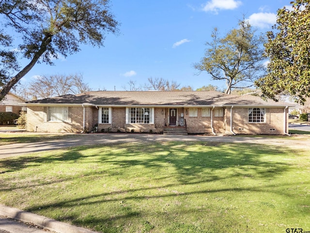 single story home with a front yard