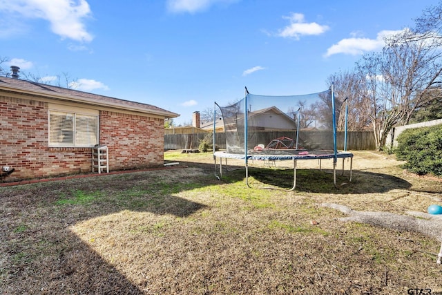 view of yard with a trampoline