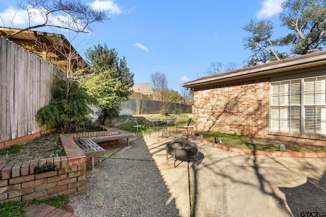 view of patio / terrace with an outdoor fire pit