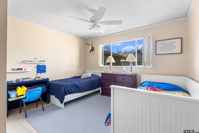 bedroom featuring crown molding, ceiling fan, and carpet flooring