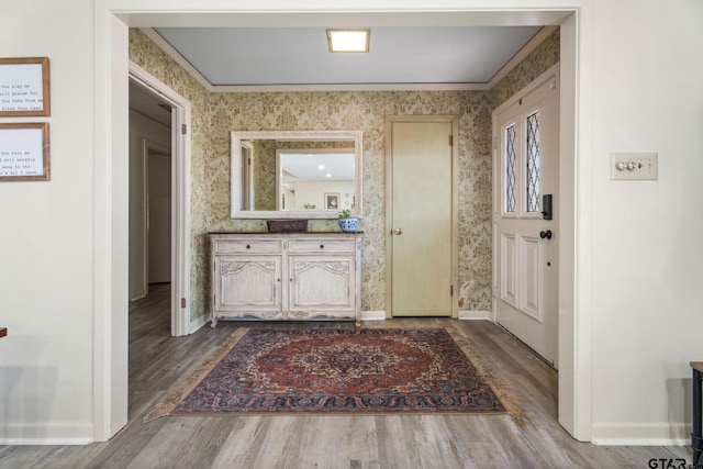 bathroom featuring hardwood / wood-style flooring, vanity, and ornamental molding