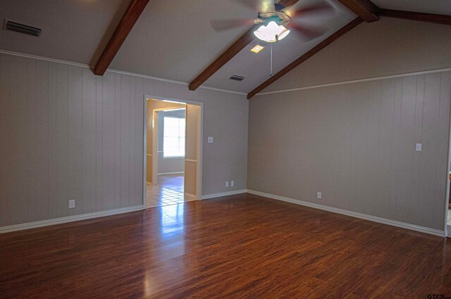 interior space with vaulted ceiling with beams, wood walls, dark hardwood / wood-style floors, and ceiling fan