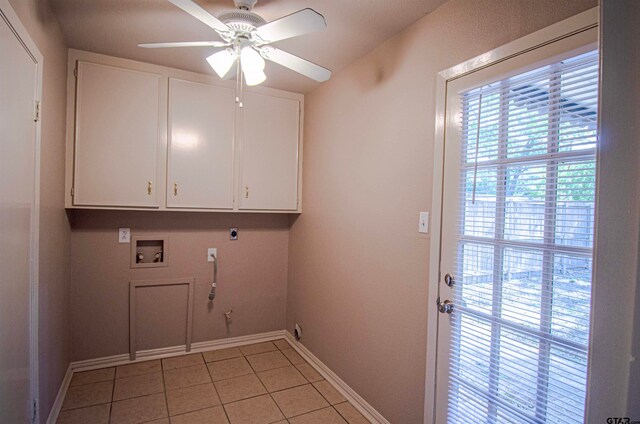 laundry room featuring hookup for an electric dryer, cabinets, ceiling fan, light tile patterned flooring, and hookup for a washing machine