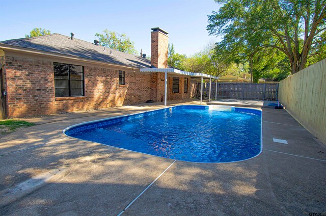 view of pool featuring a patio area