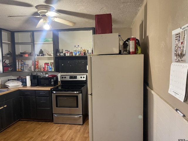 kitchen with stainless steel electric range, white fridge, a textured ceiling, light hardwood / wood-style floors, and ceiling fan