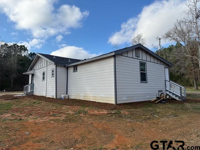 view of side of property featuring board and batten siding