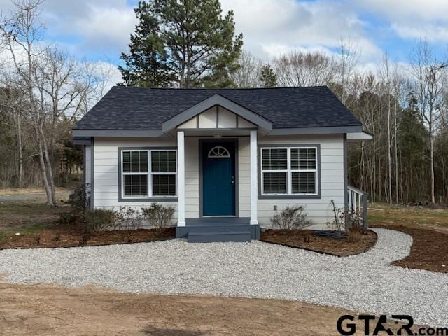 bungalow with a shingled roof