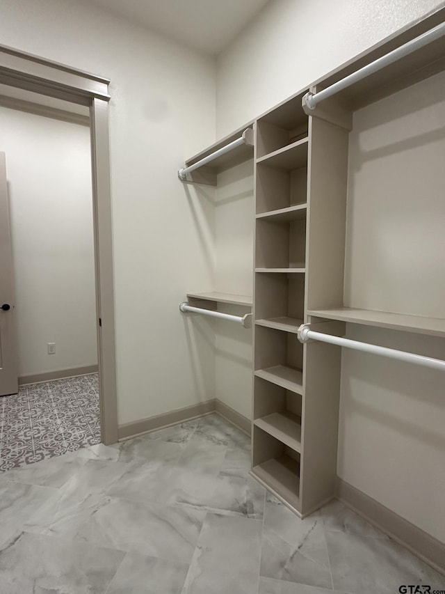 14438 Woodland Crk, Tyler, TX 75706 - walk in closet with light marble finish floors