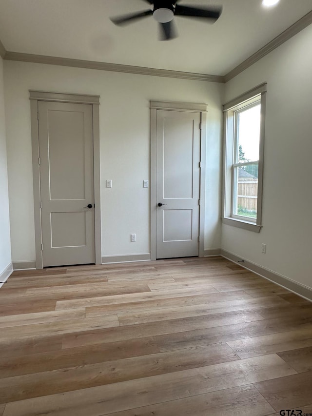 14438 Woodland Crk, Tyler, TX 75706 - unfurnished bedroom with ornamental molding, light wood-type flooring, and a ceiling fan