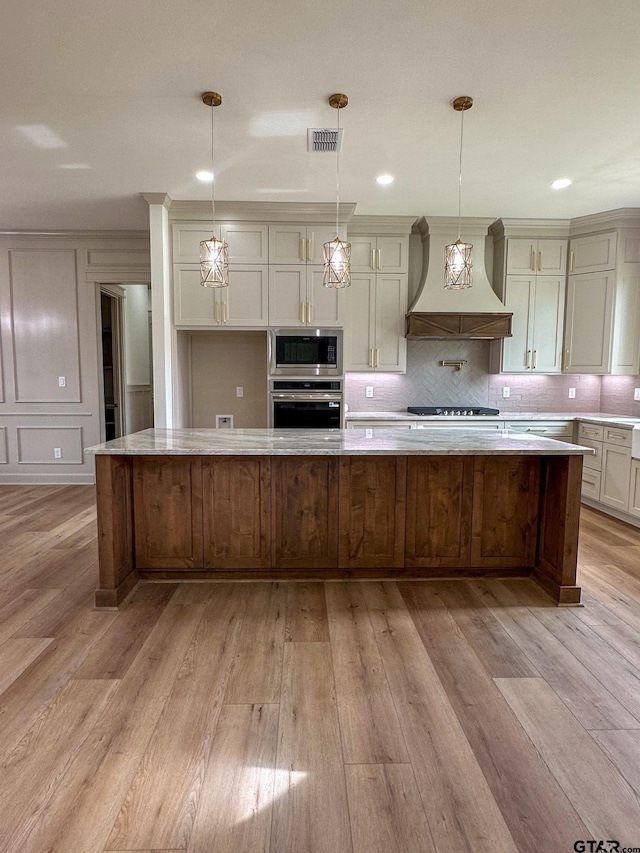 14438 Woodland Crk, Tyler, TX 75706 - kitchen featuring custom exhaust hood, stainless steel appliances, light wood-type flooring, backsplash, and recessed lighting