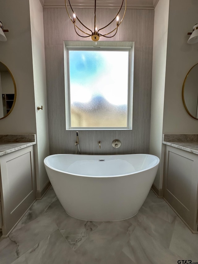 14438 Woodland Crk, Tyler, TX 75706 - full bathroom featuring wallpapered walls, vanity, marble look tiles, a freestanding bath, and a chandelier