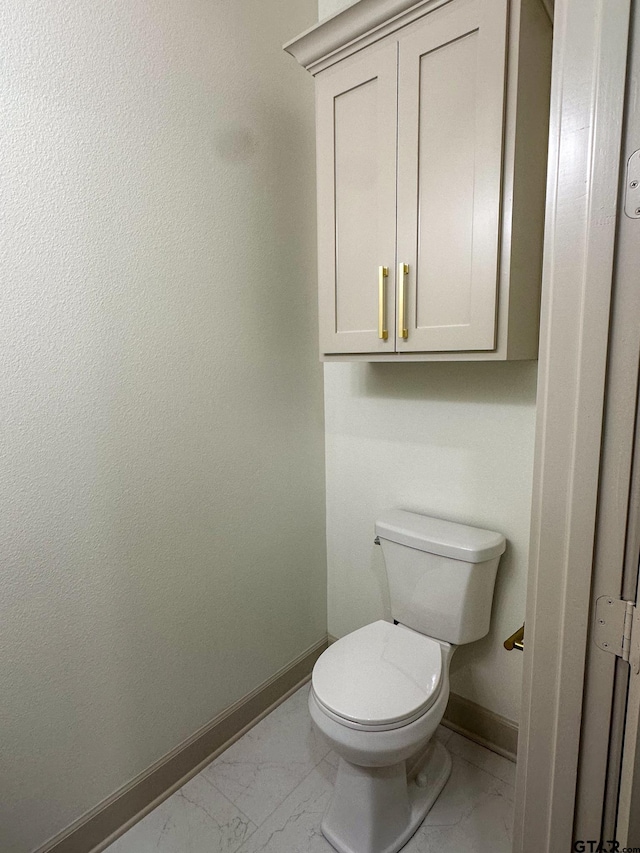 14438 Woodland Crk, Tyler, TX 75706 - bathroom with marble look tiles and baseboards