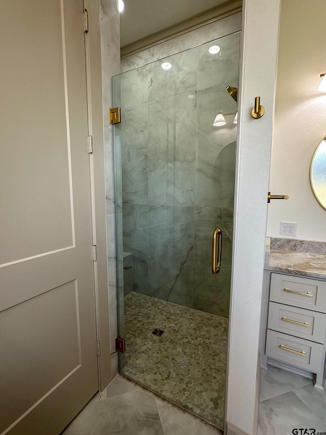 14438 Woodland Crk, Tyler, TX 75706 - full bathroom featuring a shower stall, vanity, and marble finish flooring