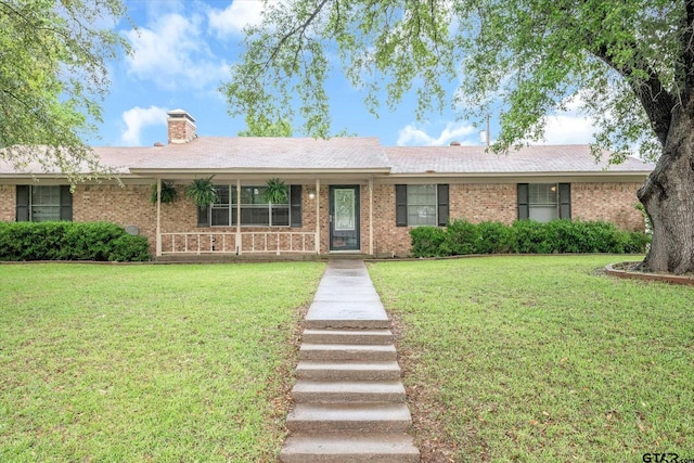 ranch-style home with a front lawn