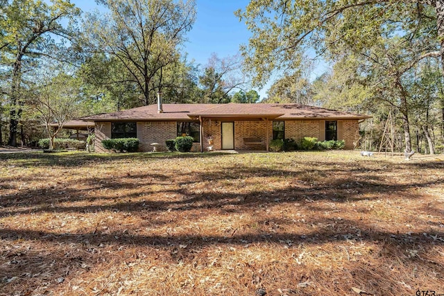 ranch-style home with a front yard