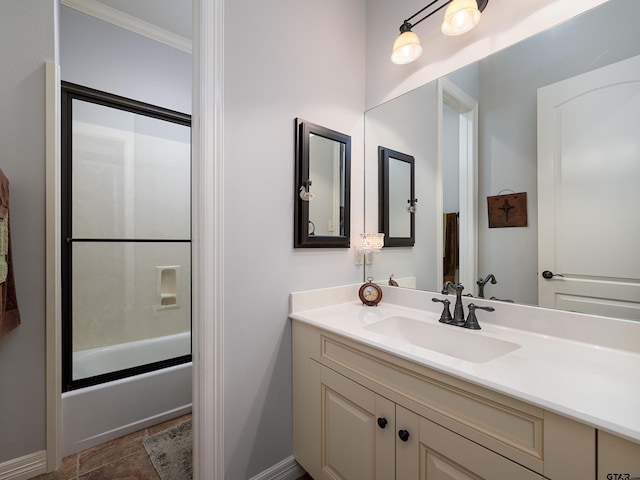 1857 Stonecrest Blvd, Tyler, TX 75703 - bathroom featuring vanity, combined bath / shower with glass door, baseboards, and ornamental molding