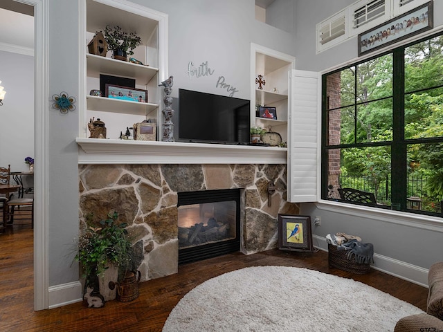 1857 Stonecrest Blvd, Tyler, TX 75703 - living room with a fireplace, wood finished floors, ornamental molding, and baseboards