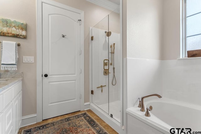 bathroom featuring vanity, shower with separate bathtub, and crown molding