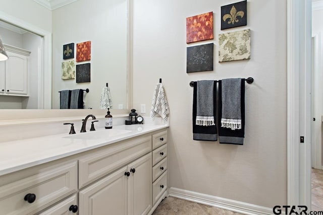 bathroom featuring vanity, tile patterned floors, and crown molding