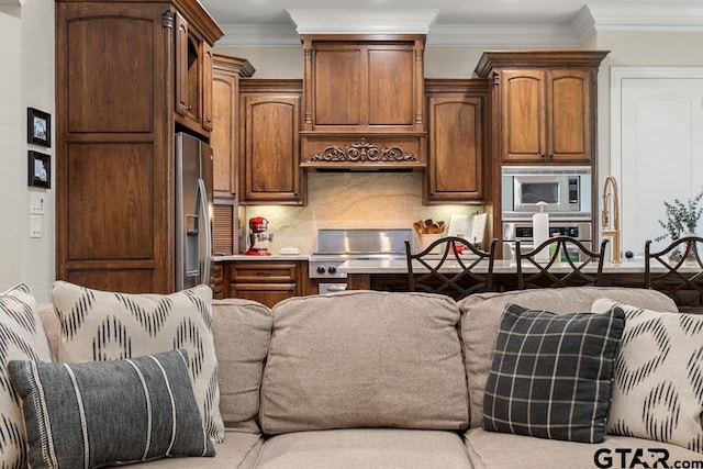 kitchen with backsplash, crown molding, and stainless steel appliances